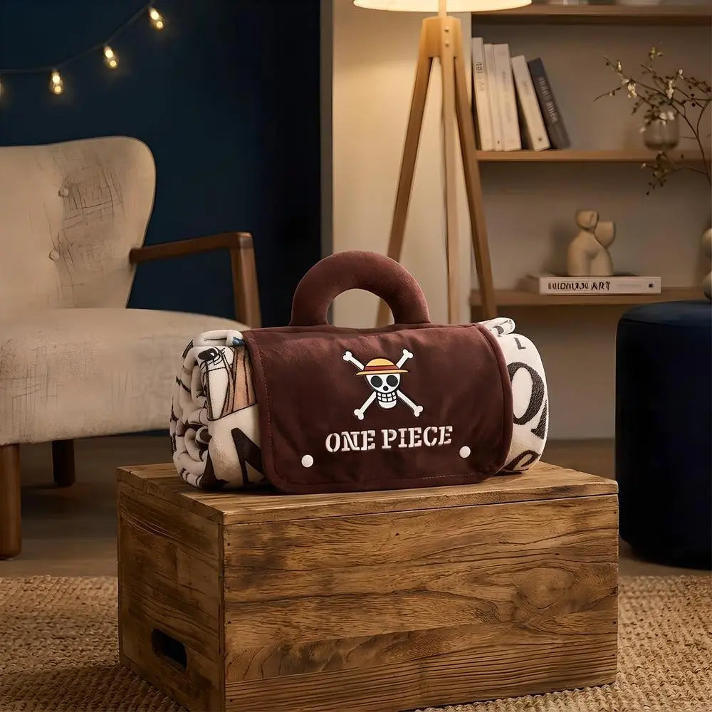 One Piece bounty poster portable fleece blanket rolled into a brown tote bag with handle on a wooden crate