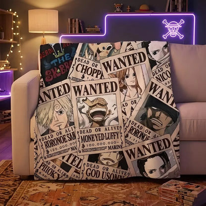 One Piece Straw Hat Pirates wanted posters throw blanket spread over a couch in cozy living room