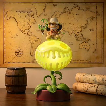 Usopp Pop Green figure lamp illuminated on wooden desk with vintage world map decor